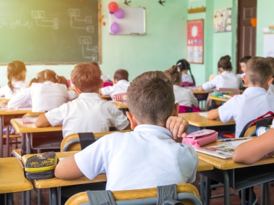 Image of schoolchildren sitting at desks in a classroom