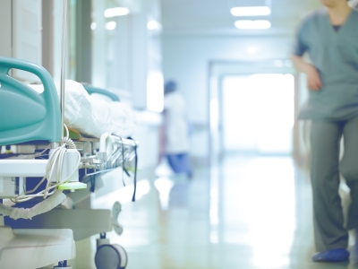 Image showing a hospital hall with hospital bed and nurse.