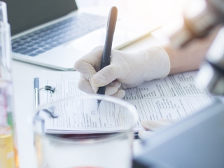 Close up shot of forensic professional in laboratory