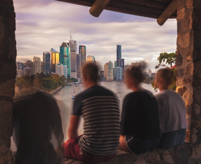 Anonymous teens overlooking Brisbane city